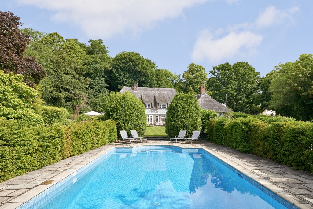 Spectacular Vistas and Poolside Lounging at Lulworth Holiday Cottages